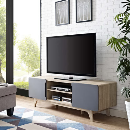 Natural gray TV stand with gray cabinet doors, open middle shelves, and a flat-screen TV in a modern living room.