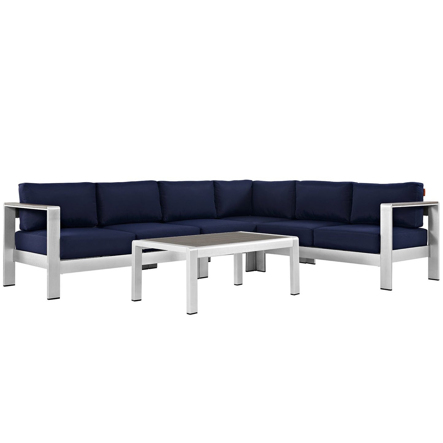 Outdoor aluminum-frame sectional sofa with navy cushions and a matching rectangular coffee table.