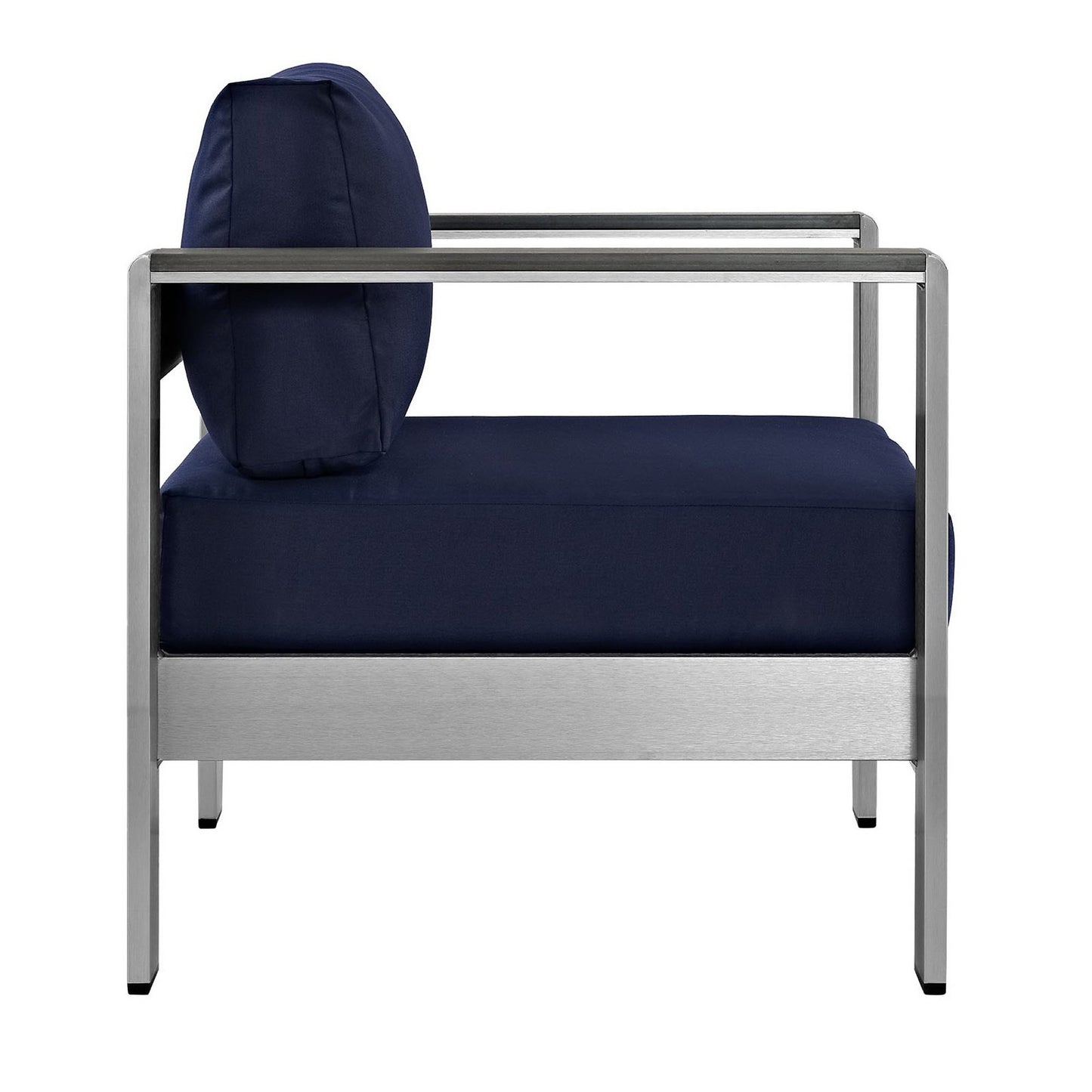 Navy cushions on a brushed-aluminum outdoor accent chair with a round bolster pillow.