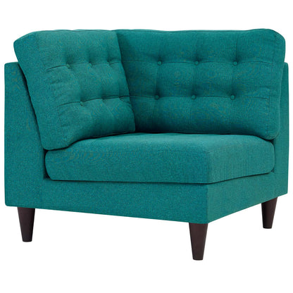 Teal upholstered corner sofa with tufted back & square cushions, dark tapered legs.
