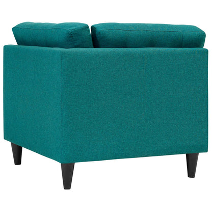 Teal fabric upholstered corner sofa with square arms and dark tapered legs.