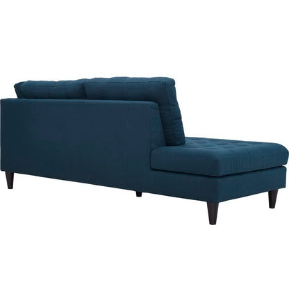 Azure blue tufted fabric left-facing bumper with low back and tapered wooden legs.
