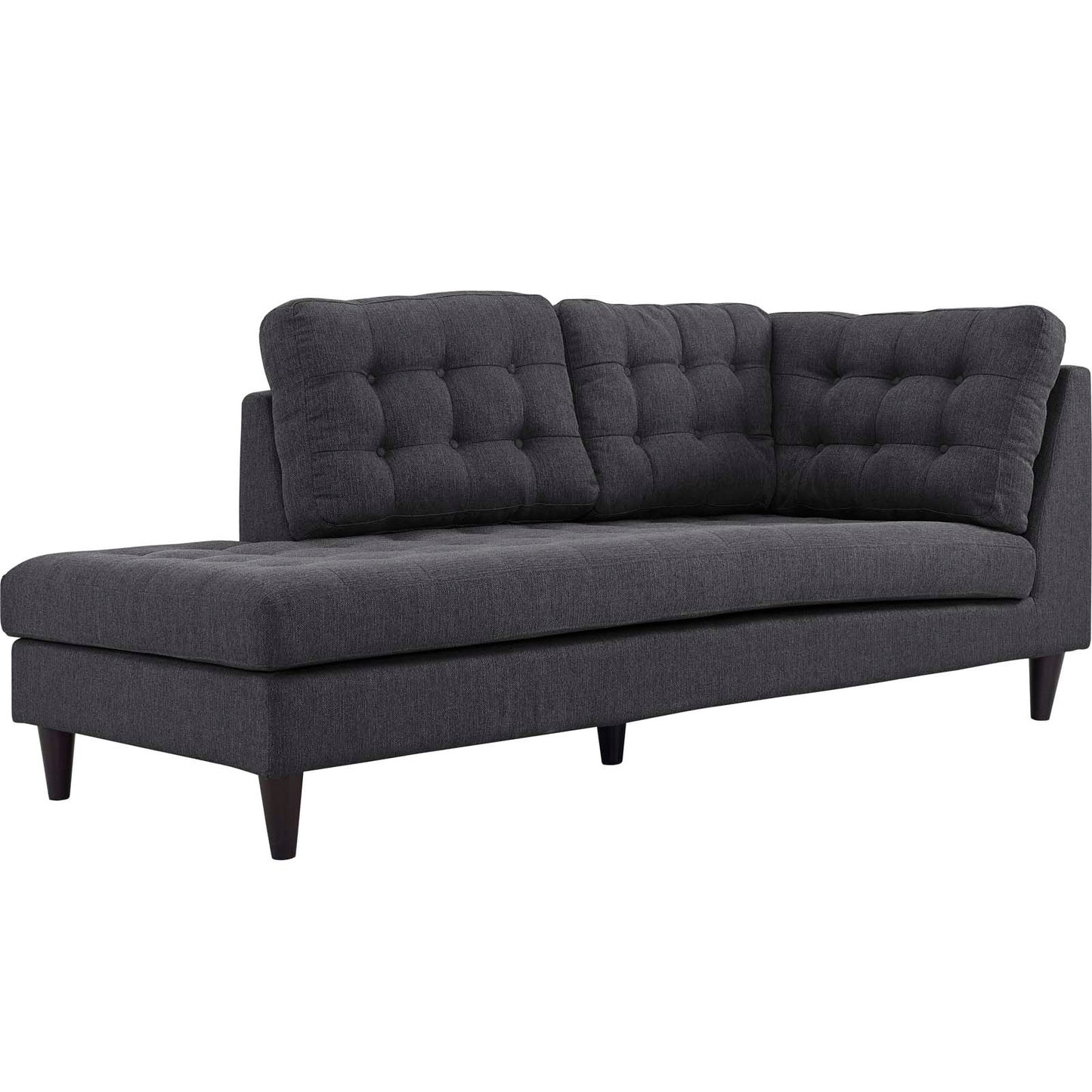 Dark gray fabric sofa with tufted back cushions and tapered wooden legs, chaise lounge style.