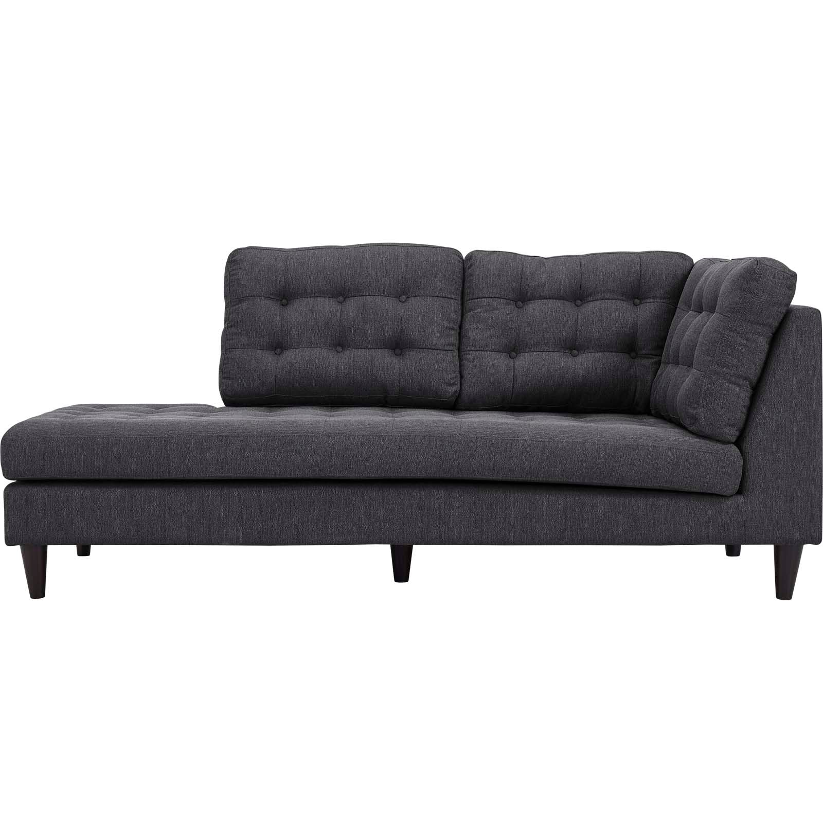 Dark gray tufted fabric sectional sofa with low wooden legs and a left-side chaise.