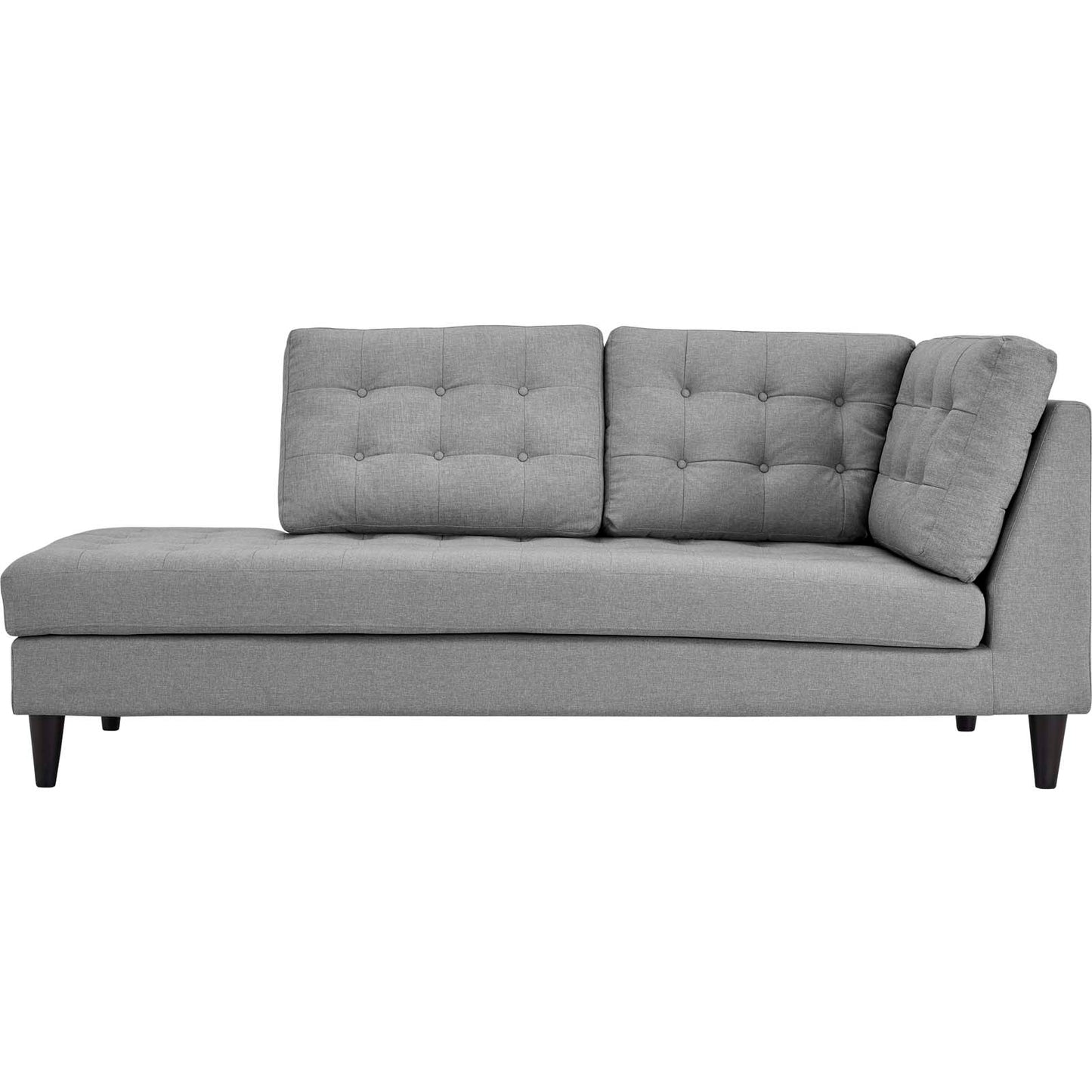 Light gray tufted fabric left-facing bumper sectional with two back cushions and a loose pillow, tapered dark wood legs, mid-century style.