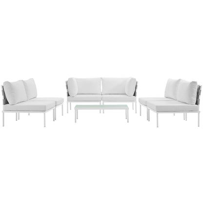White outdoor sectional sofa set with glass-top coffee table; aluminum frame and light cushions.