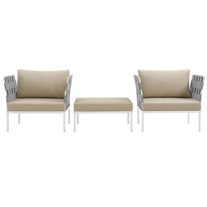 White metal outdoor lounge set with two armchairs, beige cushions, and a matching beige ottoman.