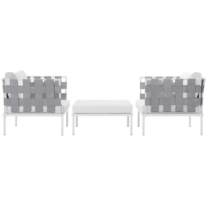 White aluminum outdoor 3-piece sectional sofa set with white cushions and gray woven straps; includes two seats and a matching white ottoman.