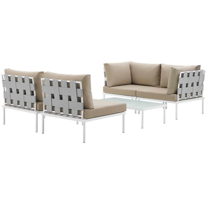 Outdoor white aluminum sectional with beige cushions, gray woven back panels, and glass-topped coffee table.