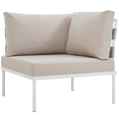 White outdoor aluminum 5-piece sectional sofa set with beige cushions.