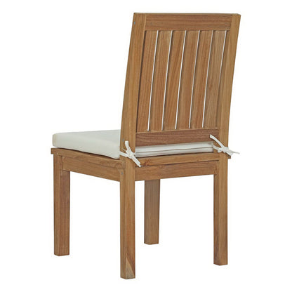 Natural wood dining chair with slatted back and white cushioned seat tied to the frame.