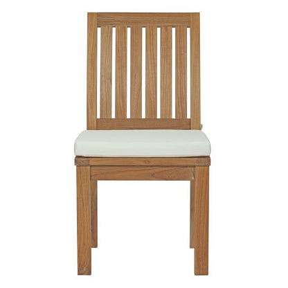 Teak outdoor patio dining chair with a vertical slat back and a white cushioned seat.