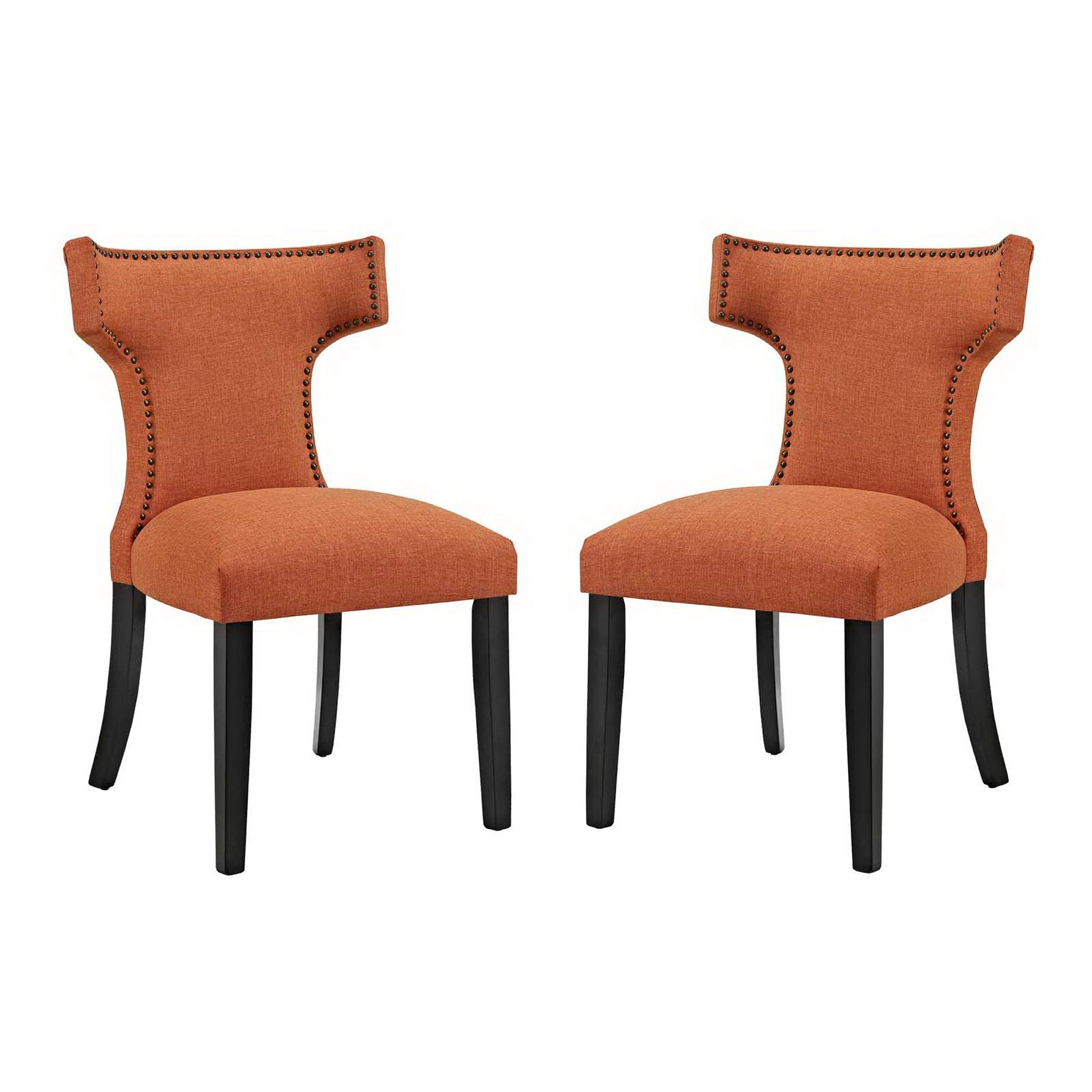 Set of two orange upholstered dining chairs with curved backs, nailhead trim, & black legs.