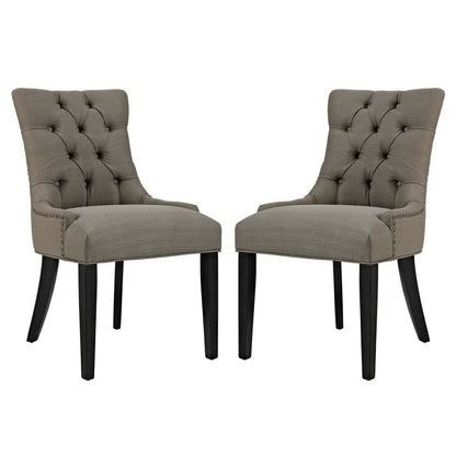Taupe fabric-upholstered tufted dining chairs, set of two with nailhead trim and black tapered legs.