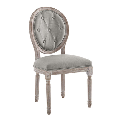 Oval-back tufted grey chair with weathered wood frame and turned legs; dining or accent seating.