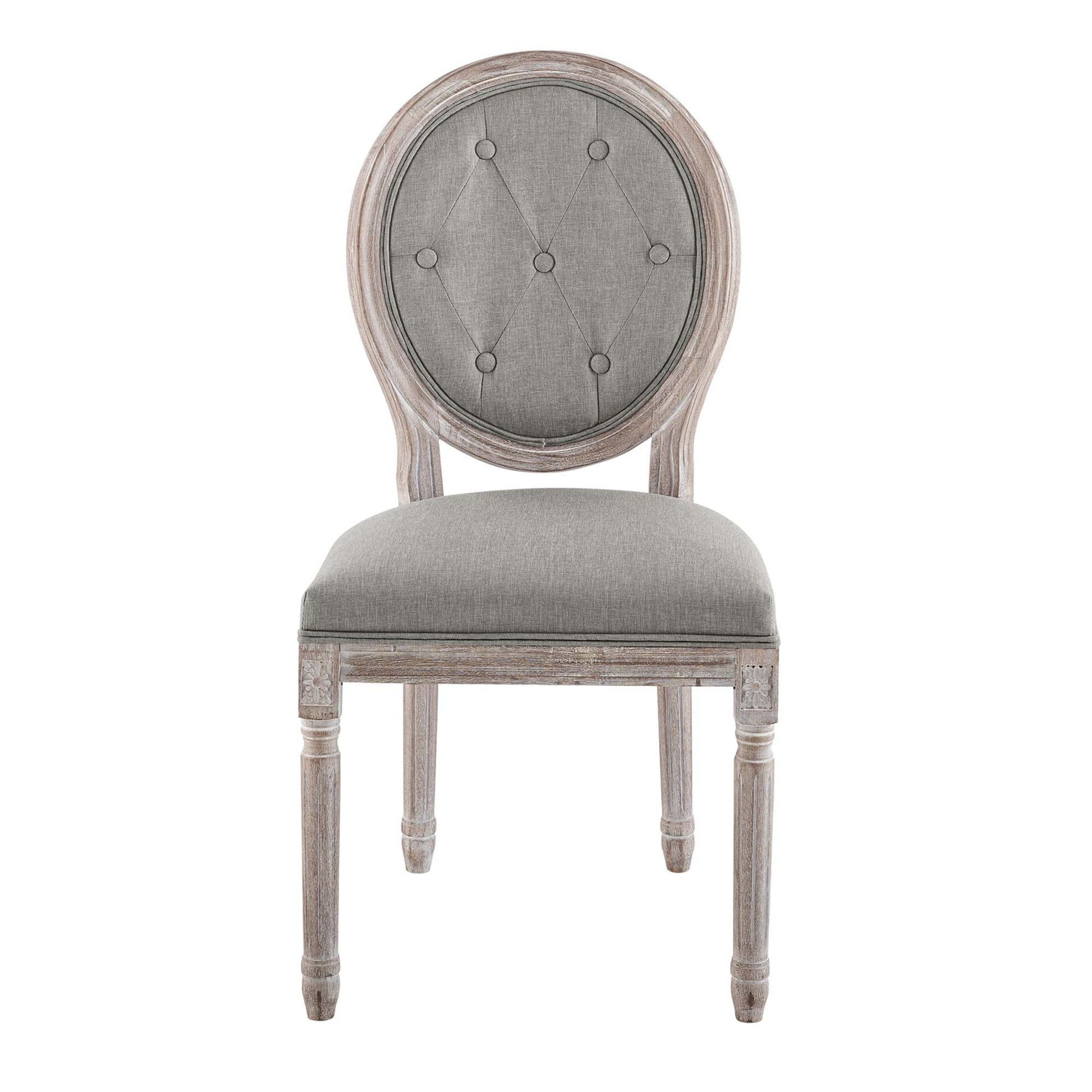 Round-tufted gray back dining chair with cushioned seat and distressed light-washed wooden frame.