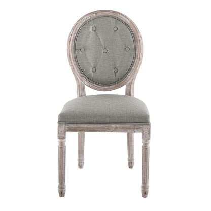 Round-tufted gray back dining chair with cushioned seat and distressed light-washed wooden frame.