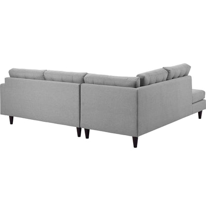 Grey fabric left-facing L-shaped sectional sofa with chaise & dark tapered legs.