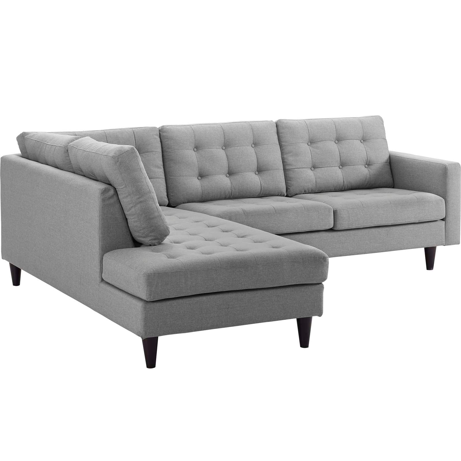 Grey fabric L-shaped sectional sofa with chaise, tufted back cushions and tapered dark wood legs