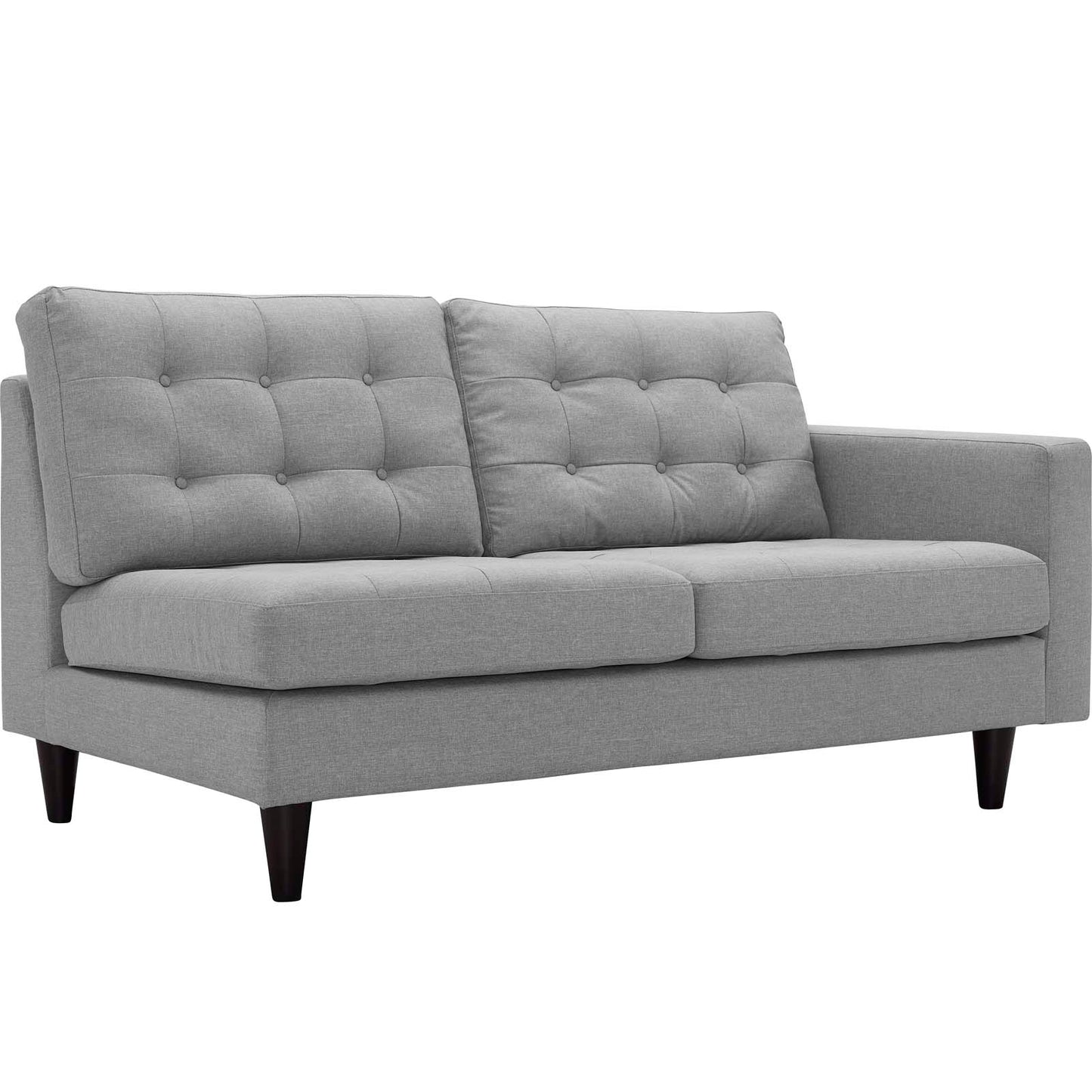 Grey fabric left-facing bumper sectional with tufted back cushions, straight arms and dark tapered legs.