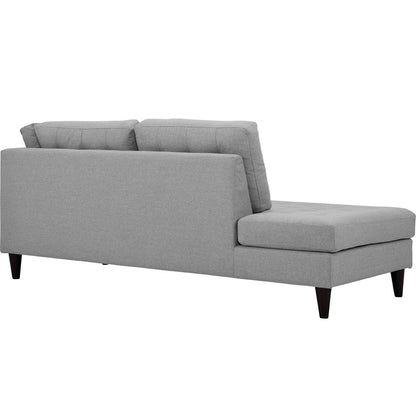 Light gray fabric sectional sofa with a chaise, tapered dark wood legs, two back cushions, contemporary living room seating.
