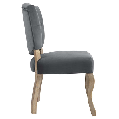 Grey velvet-like dining chair with cushioned backrest and slender curved wooden legs.