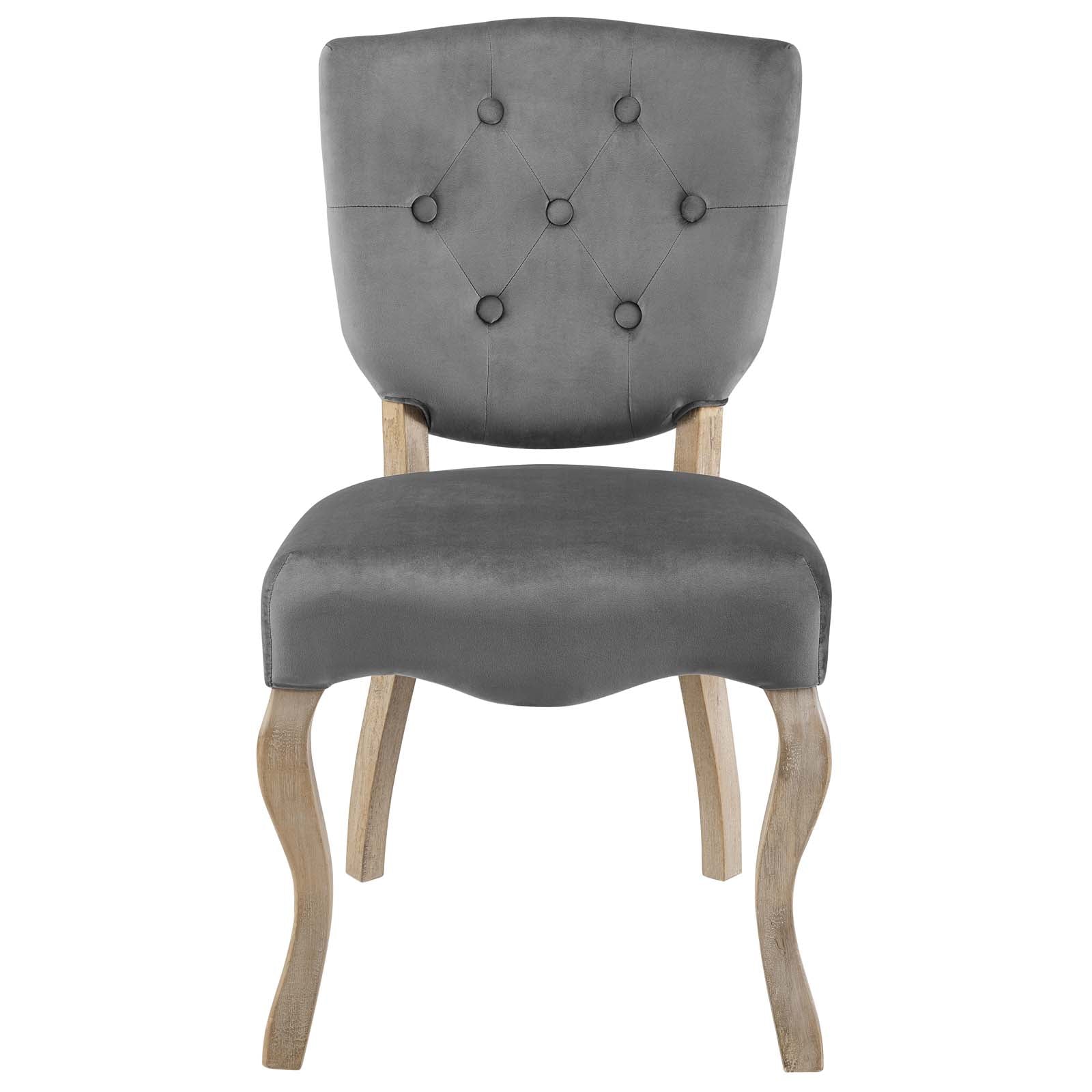 Grey velvet-upholstered dining side chair with diamond-tufted back and light wood curved legs; vintage-style accent chair.