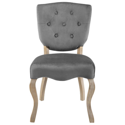 Grey velvet-upholstered dining side chair with diamond-tufted back and light wood curved legs; vintage-style accent chair.