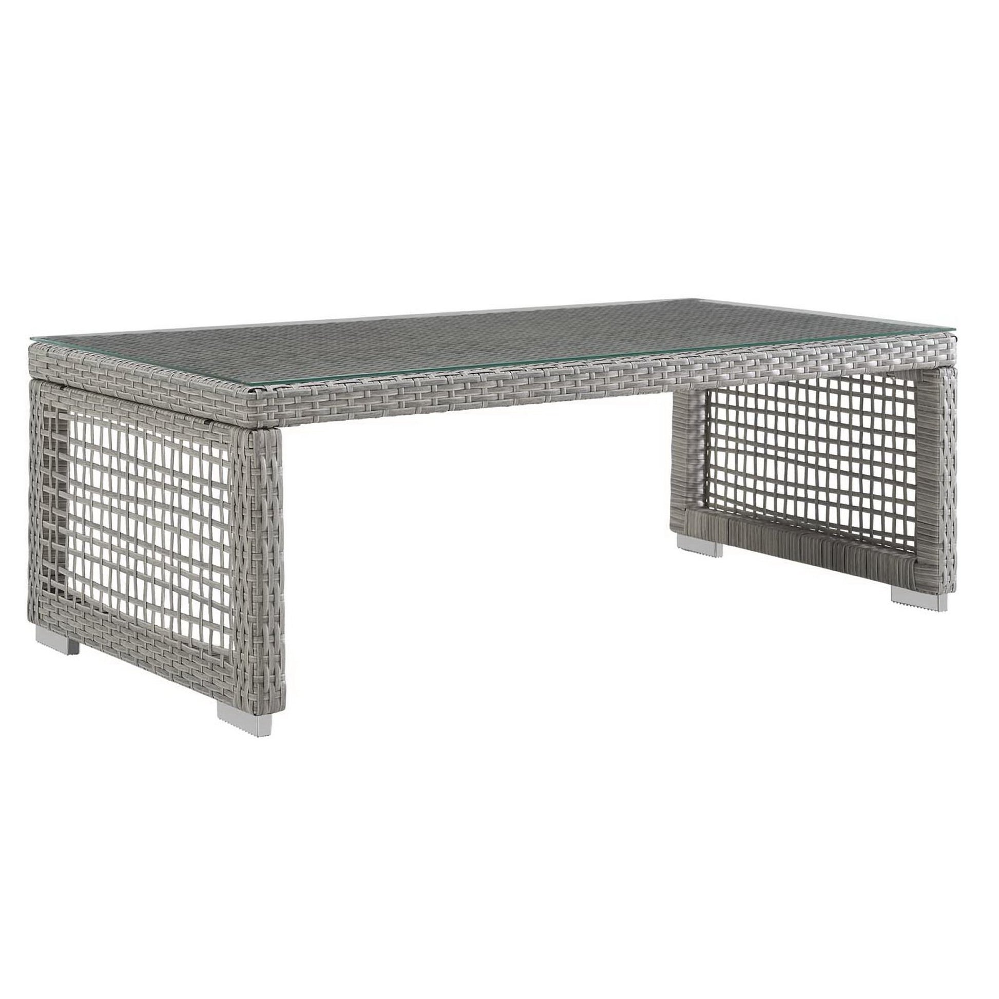 Rectangular gray wicker coffee table with glass top and open lattice sides.