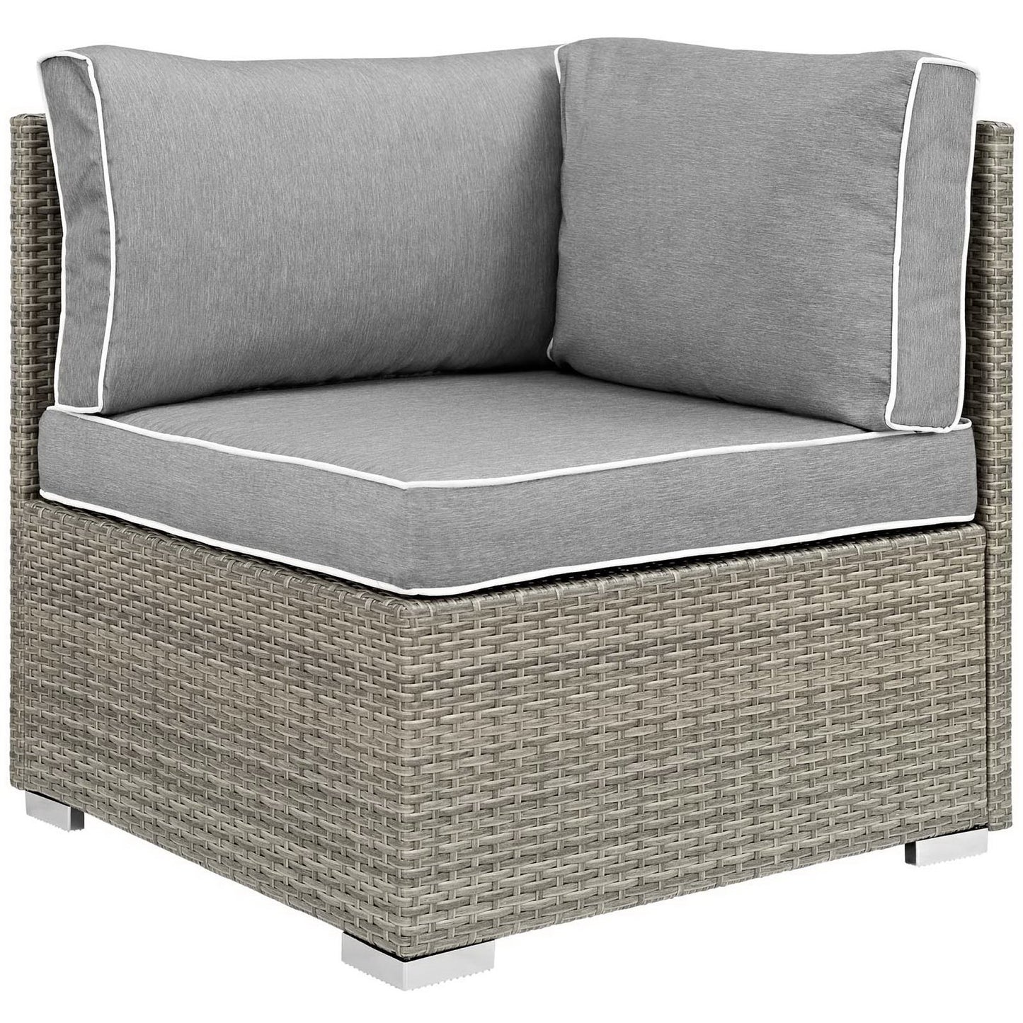 Gray outdoor wicker corner seating unit with thick cushioned seat and two back cushions, white piping.