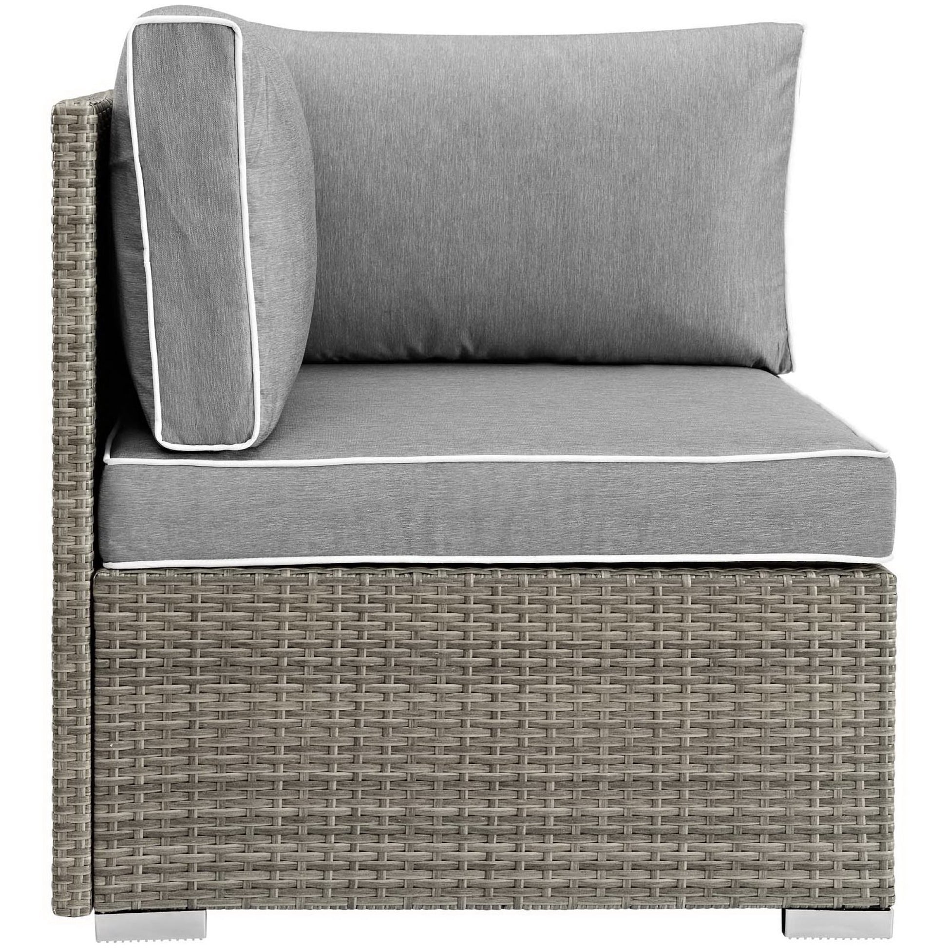 Gray outdoor wicker corner sectional with thick cushioned seats and back cushions, white piping.