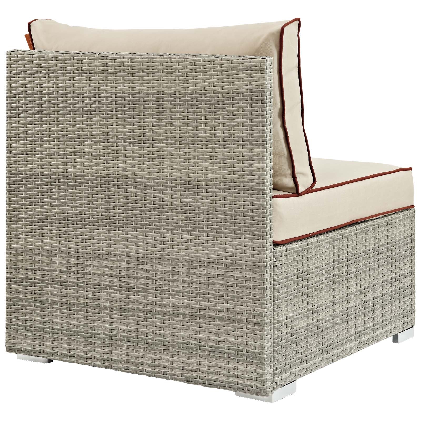 Light gray-beige woven rattan outdoor armless chair with beige cushions and red-brown piping.