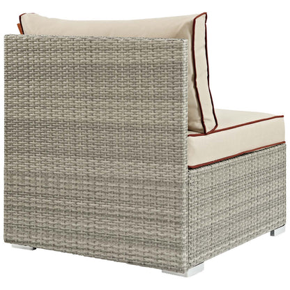 Light gray-beige woven rattan outdoor armless chair with beige cushions and red-brown piping.