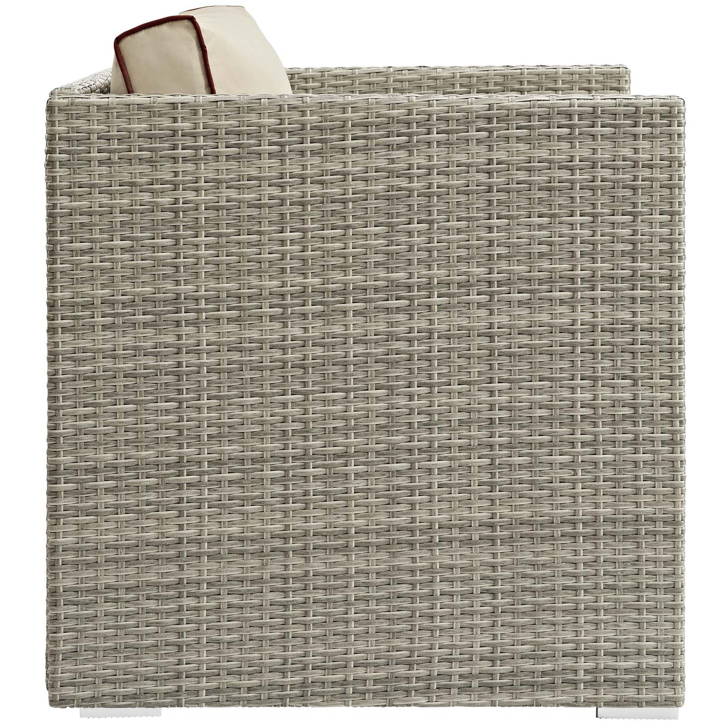 Gray-beige resin wicker outdoor armchair with cream cushion & red piping peeking over the edge