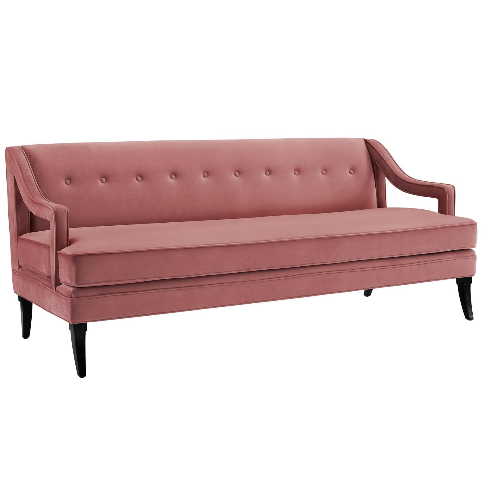 Dusty rose velvet sofa with tufted back, curved arms, single seat cushion, black tapered legs.