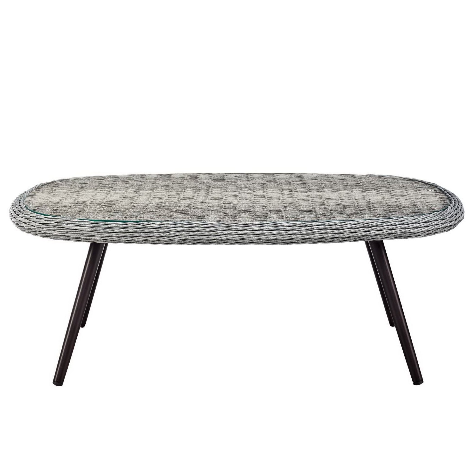 Oval gray wicker rattan coffee table with glass inset and dark angled legs