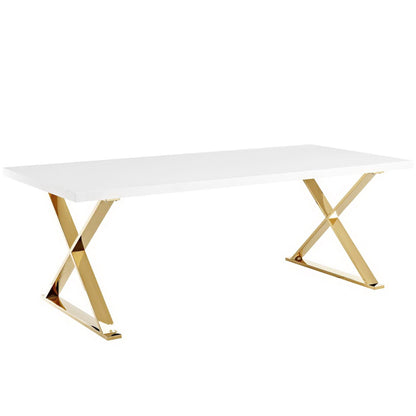 White rectangular dining table with gold-tone metal X-frame legs.