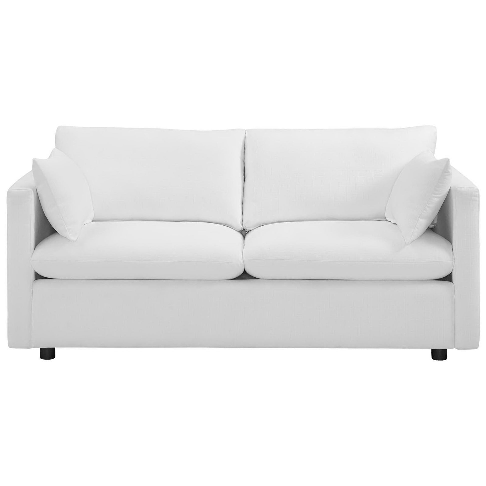 White fabric sofa with two-seat cushions, two back cushions, square arms, and low legs.