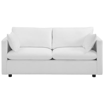 White fabric sofa with two-seat cushions, two back cushions, square arms, and low legs.