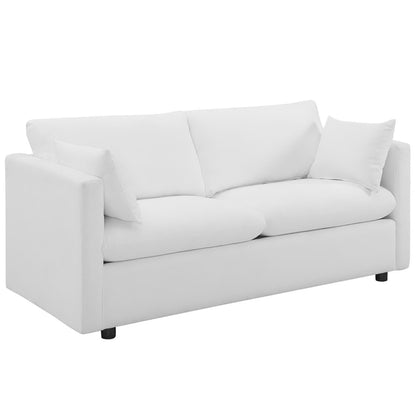 White fabric sofa with straight arms, two-seat cushions, two back cushions, and two matching throw pillows.