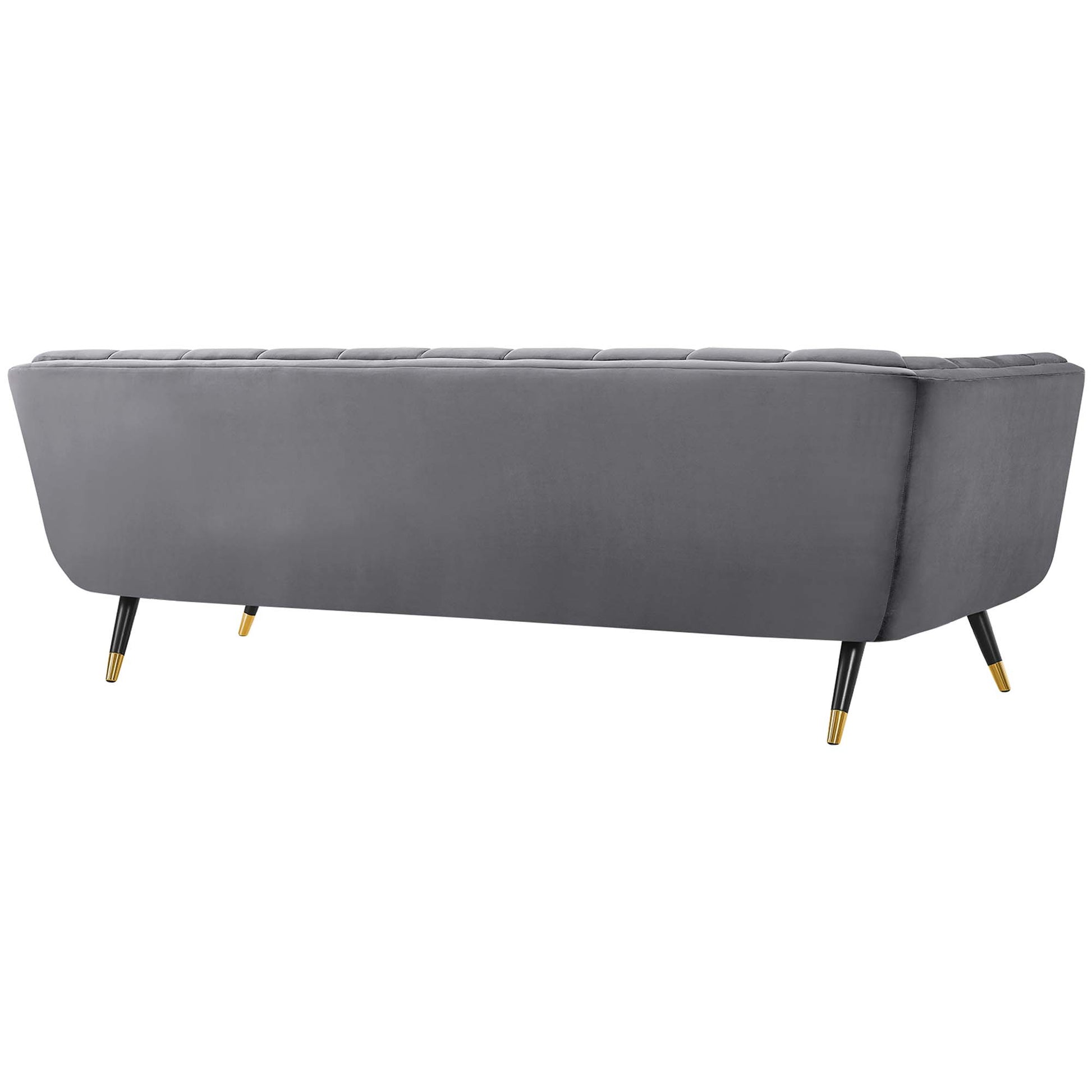 Grey upholstered sofa with tufted back cushions, curved arms, black legs and gold-tipped feet.