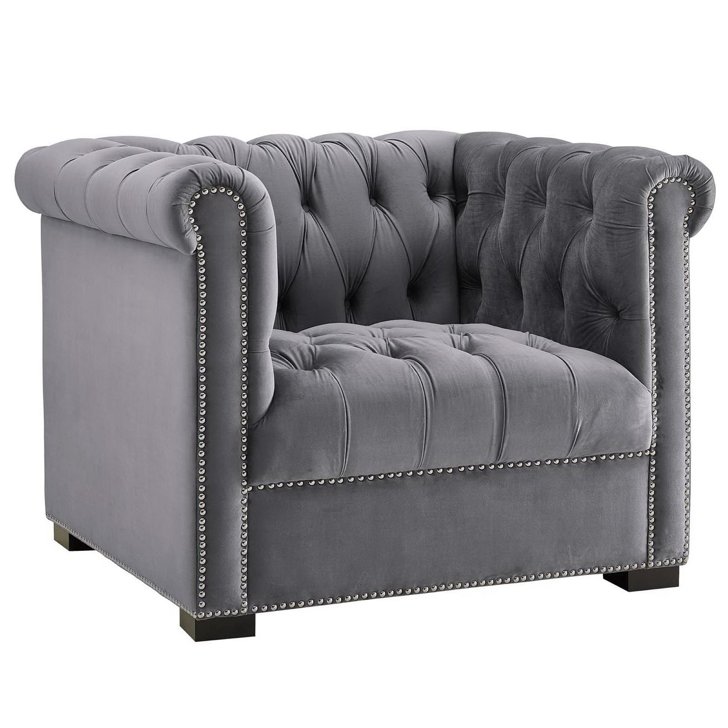Gray velvet tufted armchair with rolled arms, nailhead trim, and square wooden feet.