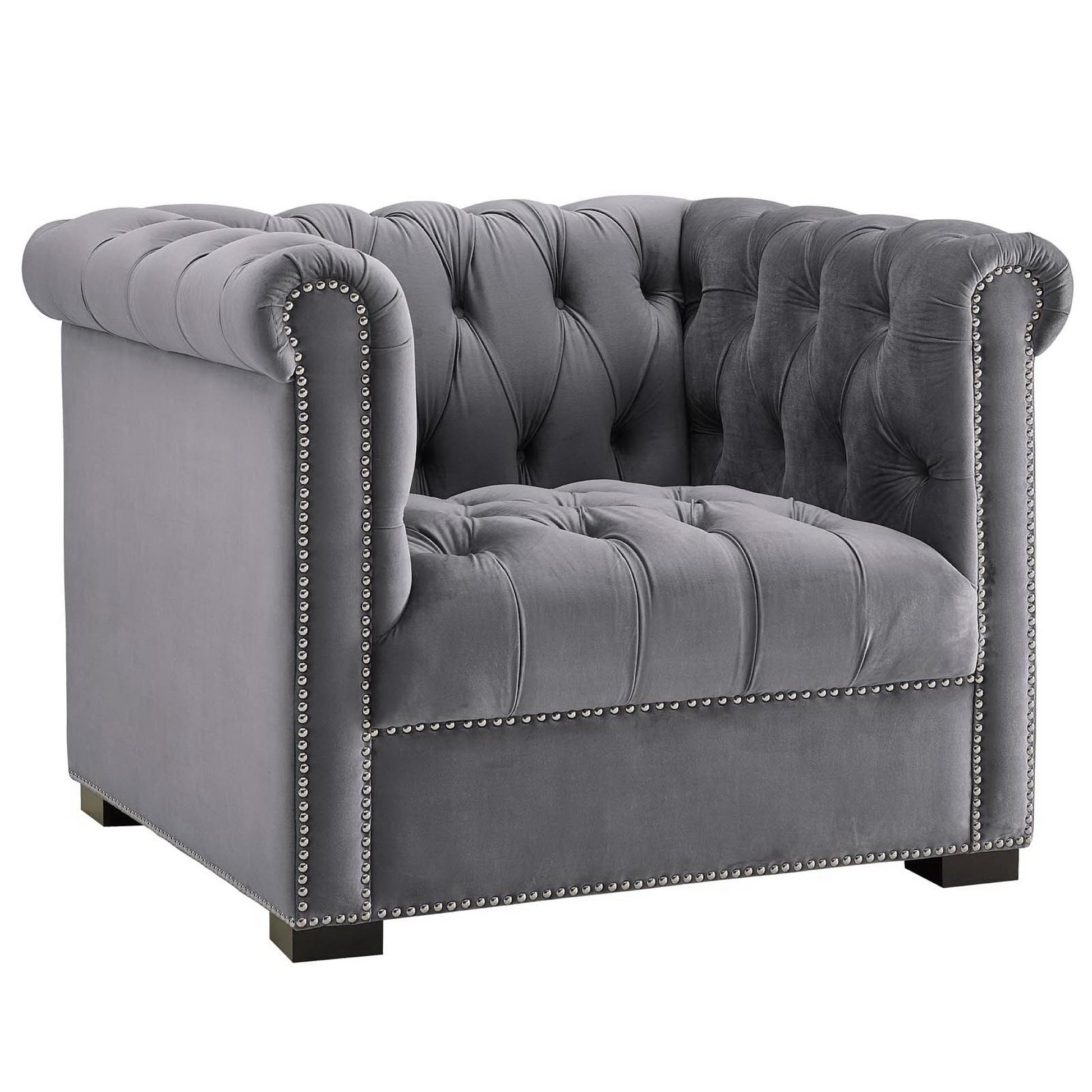 Gray velvet tufted armchair with rolled arms, nailhead trim, and square wooden feet.