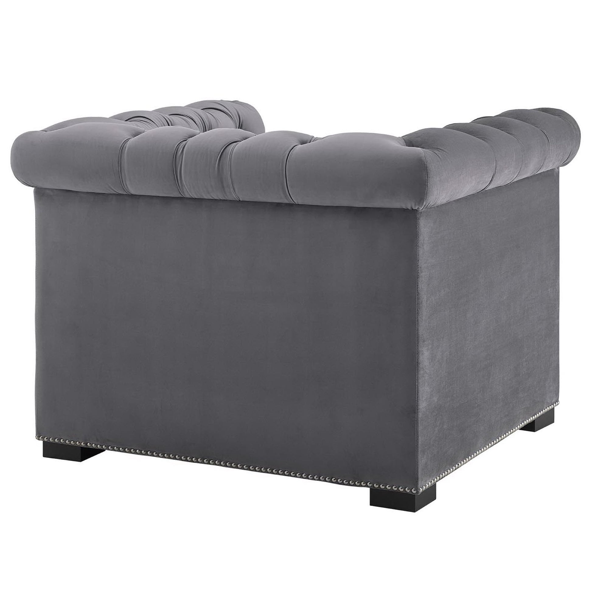Grey velvet tufted armchair with nailhead trim, square block feet, plush seat, modern living room seating.