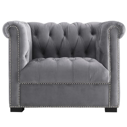 Grey velvet tufted Chesterfield armchair with rolled arms, nailhead trim & short block feet.