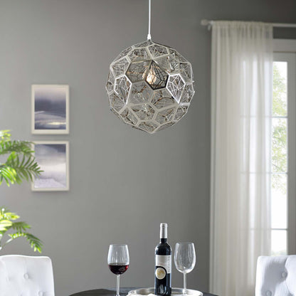 Geometric silver sphere pendant chandelier with open lattice hangs in a modern gray living room, above wine bottle & glasses.