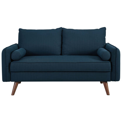 Dark blue fabric mid-century modern loveseat with two back cushions, cylindrical bolster pillows and tapered wooden legs.