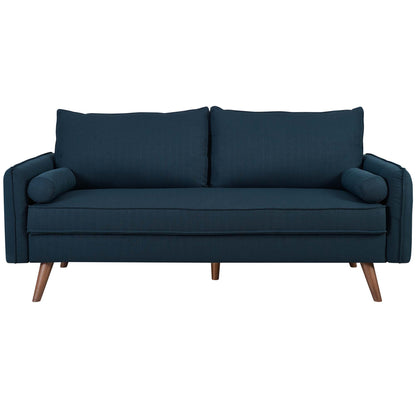 Azure blue fabric sofa with mid-century wooden legs, two large back cushions and cylindrical bolsters.