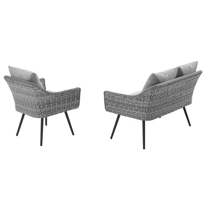 Set of two gray outdoor wicker rattan pieces: a loveseat and an armchair, with light gray cushions and black metal legs.