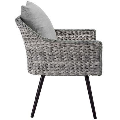 Grey woven rattan loveseat and armchair set with black angled metal legs and light grey cushions, outdoor patio furniture.